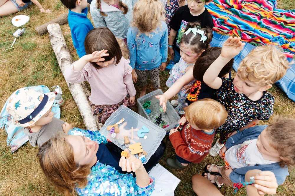 Children taking part in an outdoor activity at Adventure Club